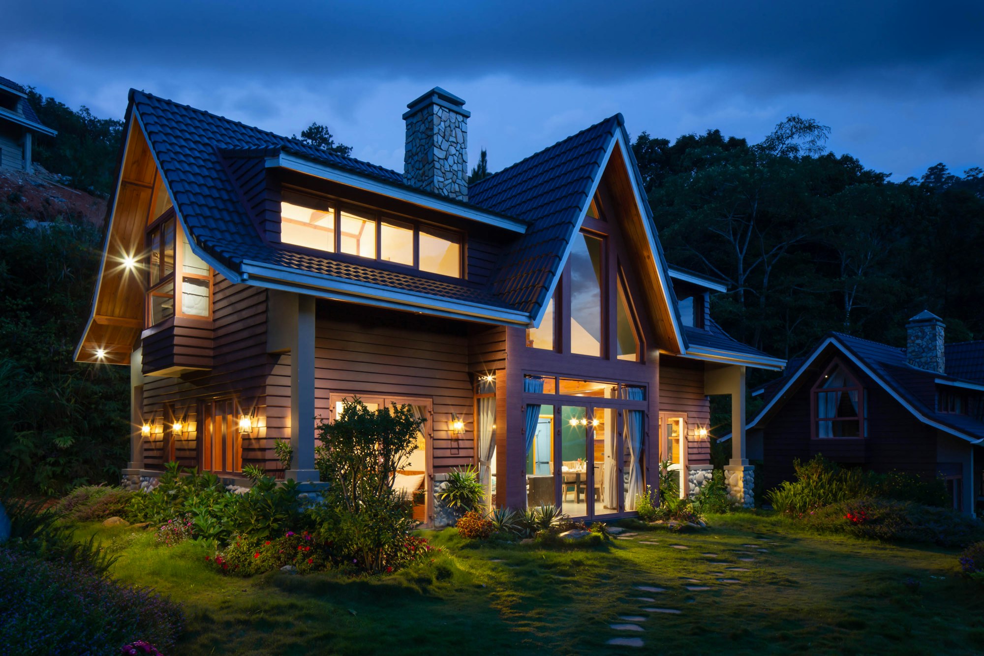 Craftsman-style home illuminated at dusk