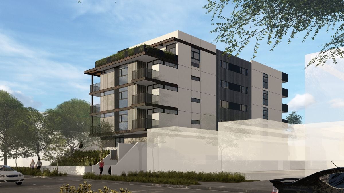 Modern four-story apartment building with balconies and minimalist residential architecture